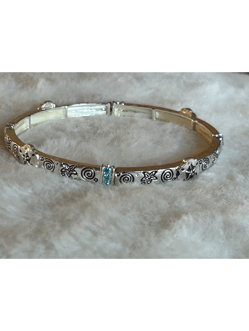 Silver Tone Starfish and Swirl Pattern Stretch Bracelet with Blue Rhinestones